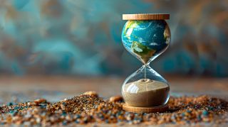 An image representing Earth Overshoot Day, marked by a sand cloc